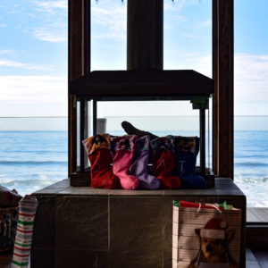 stockings on the hearth in front of the ocean